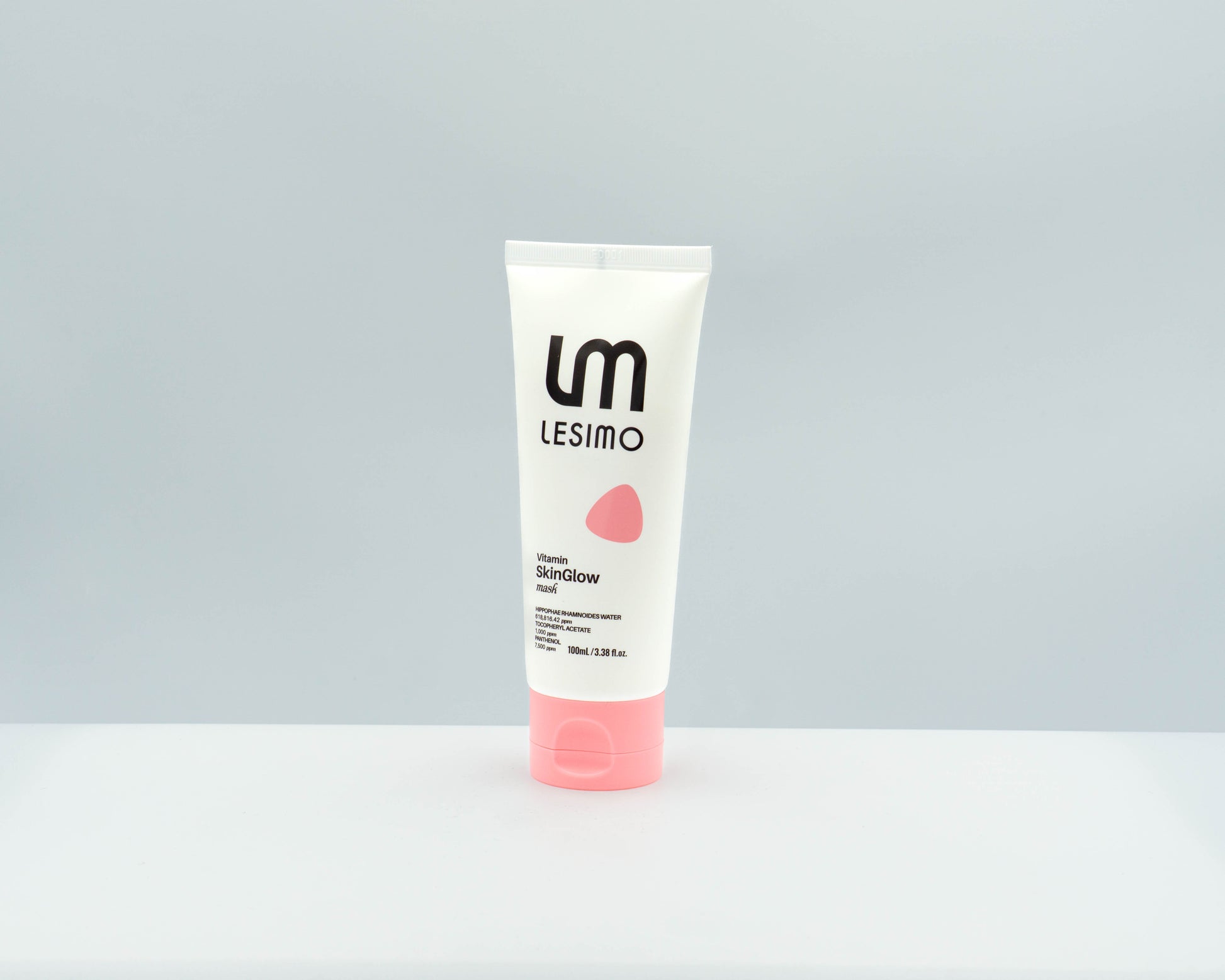 Tube of Lesimo skincare product on a gray background